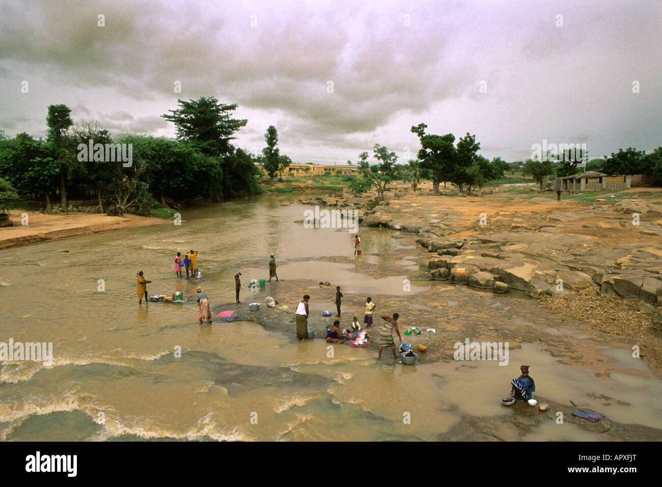 Women washing clothes in the river Stock Photo - Alamy