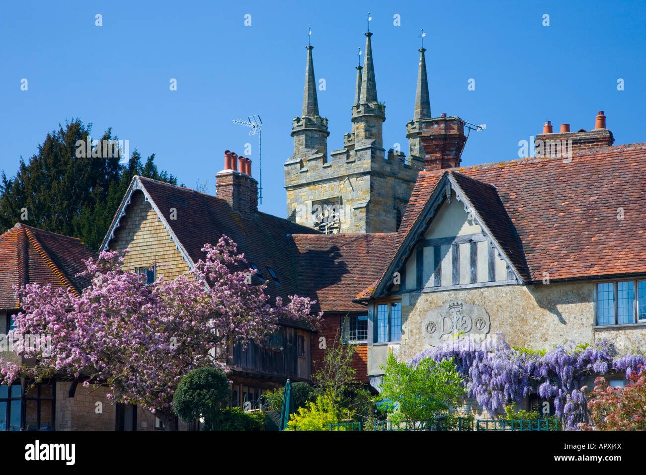Penshurst, Kent, England. Tower of the Church of St John the Baptist and medieval timbered houses. Stock Photo