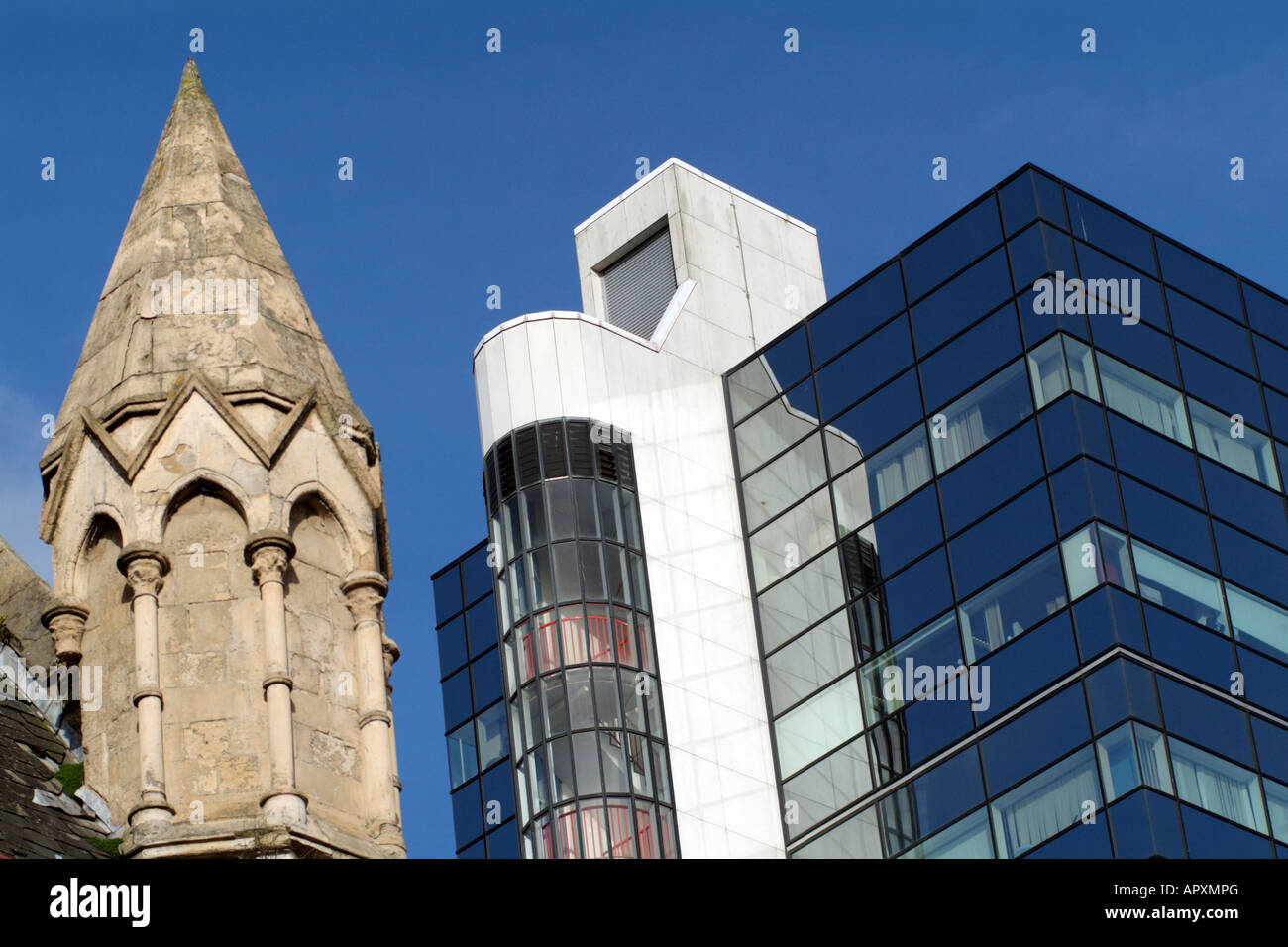 British Gas Office Building Cardiff South Wales and an Old Church Spire Stock Photo