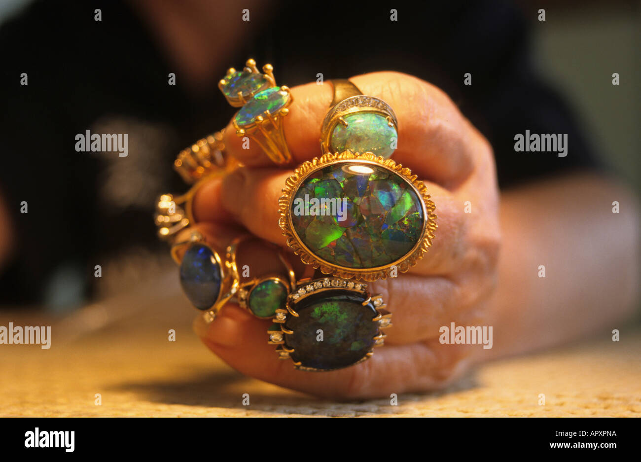 opal rings on hand, NSW, Australia Stock Photo