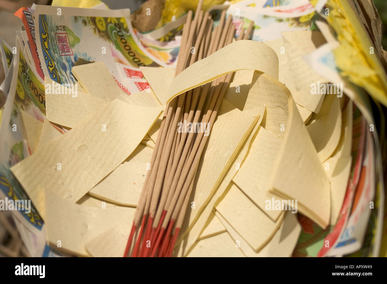 Hell money and josticks ready for burning during the Qing Ming Festival, Malaysia, South East Asia Stock Photo