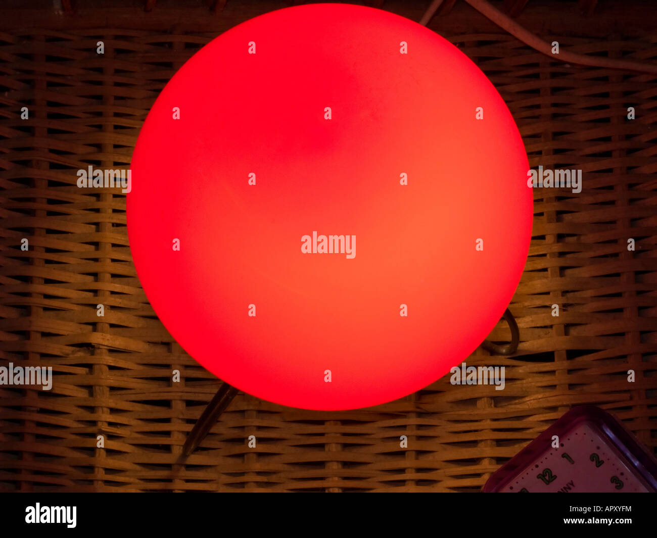 Red bedside table light and alarm clock Stock Photo Alamy