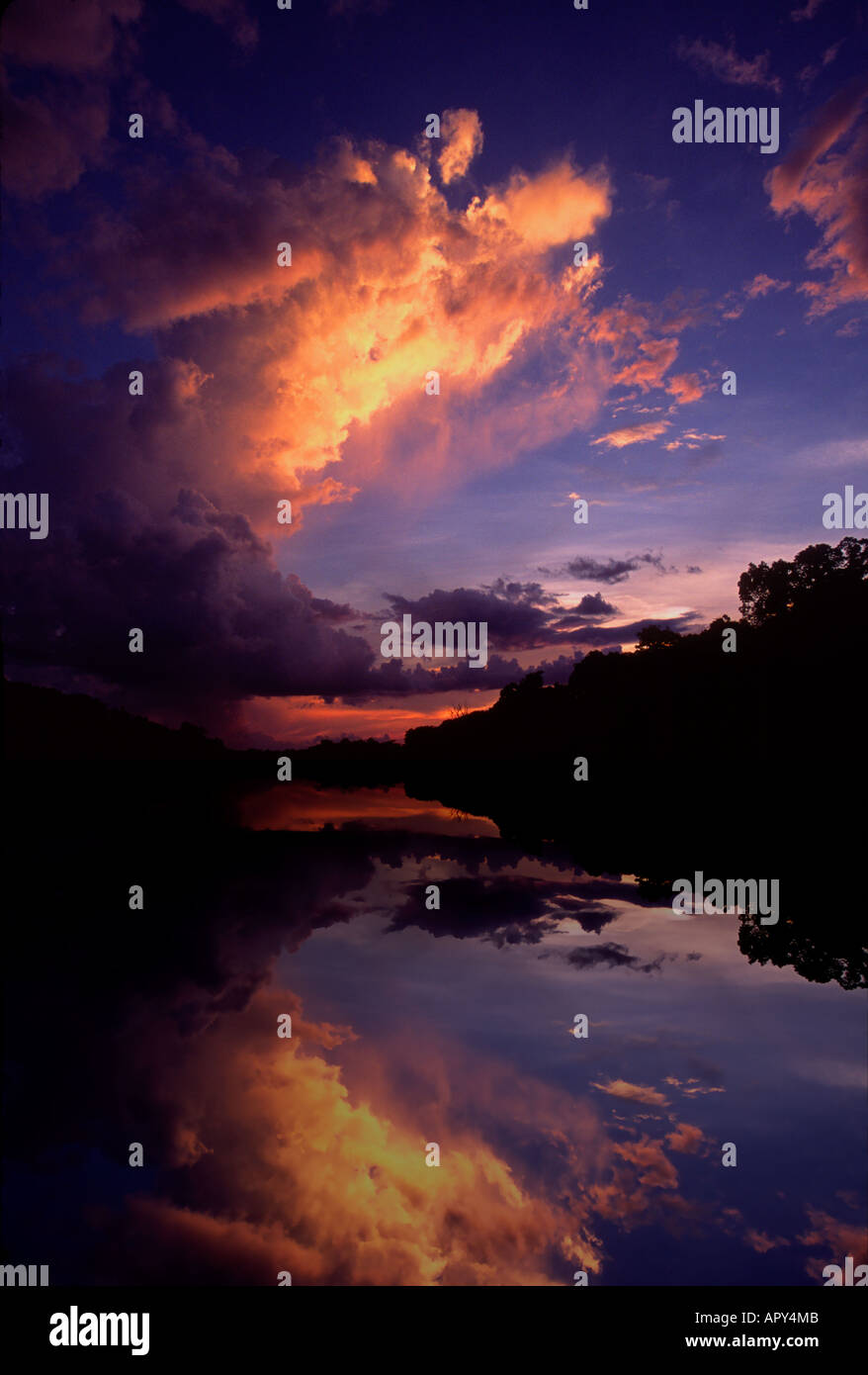 Sunset colors clouds above the Nanay River, Amazon River Basin, Peru Stock Photo