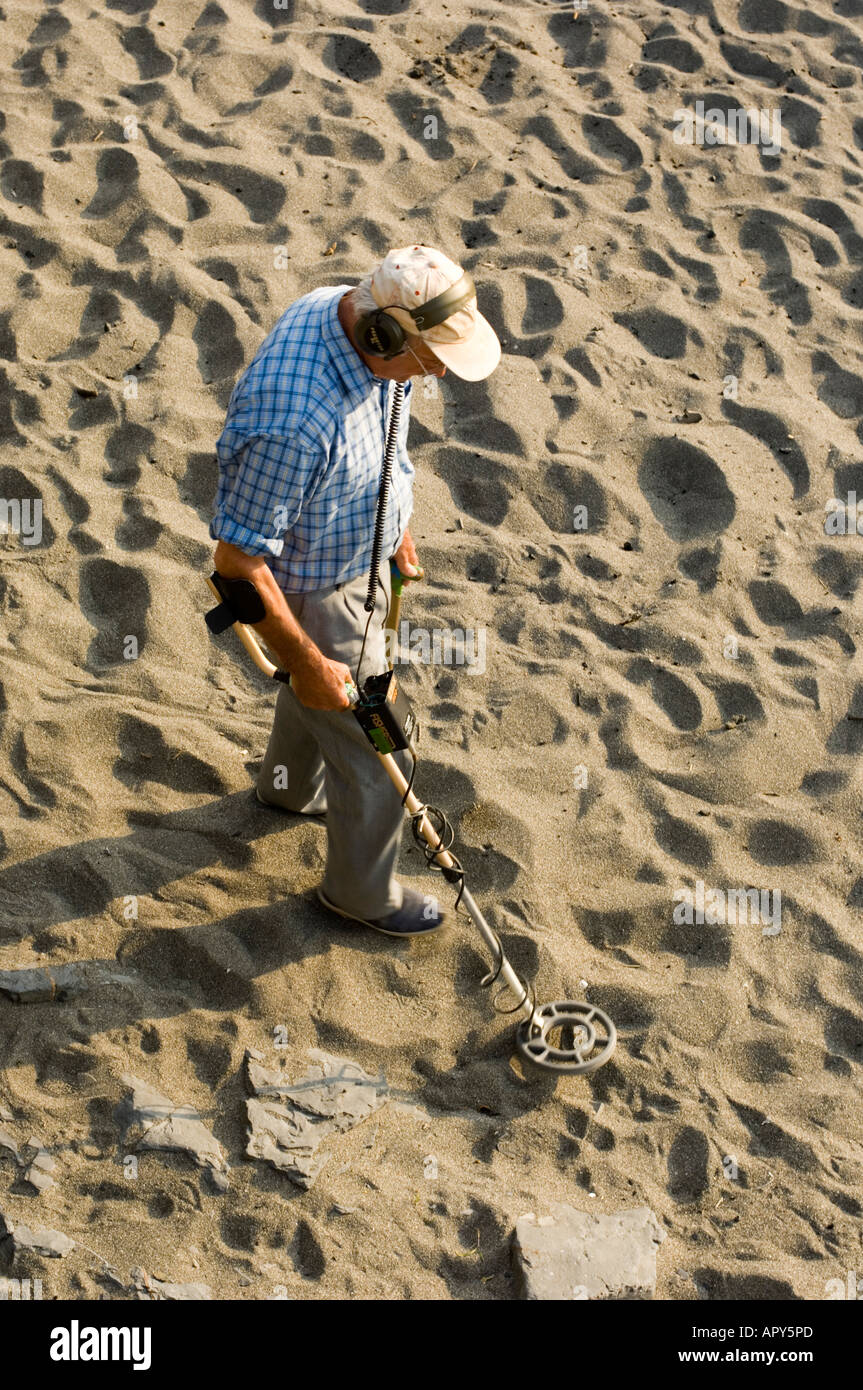 male Metal detectorist on the beach Aberystwyth ceredigion wales Stock