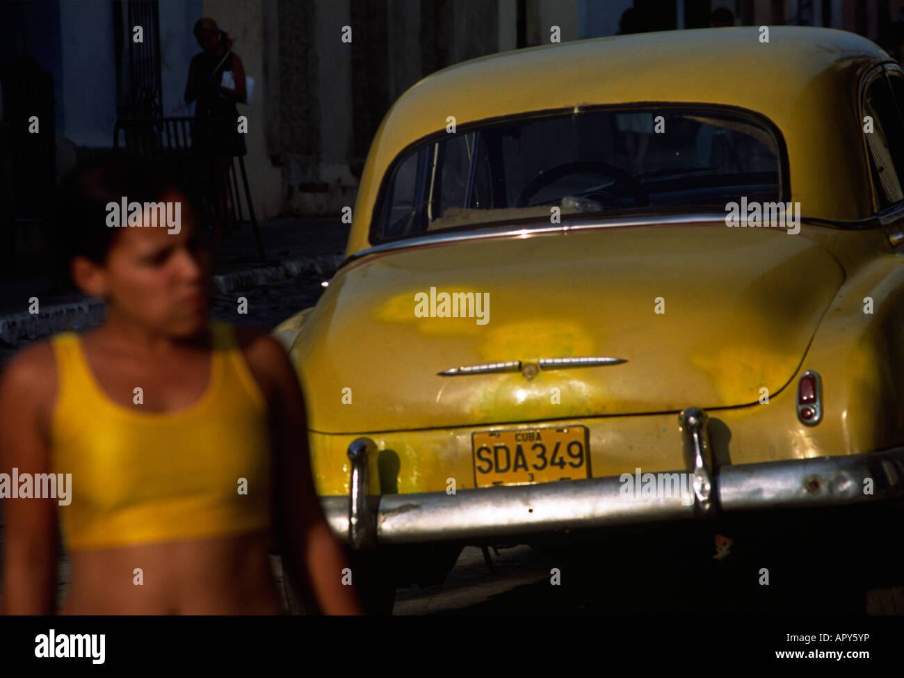 cuba woman and car havana street scene Stock Photo - Alamy