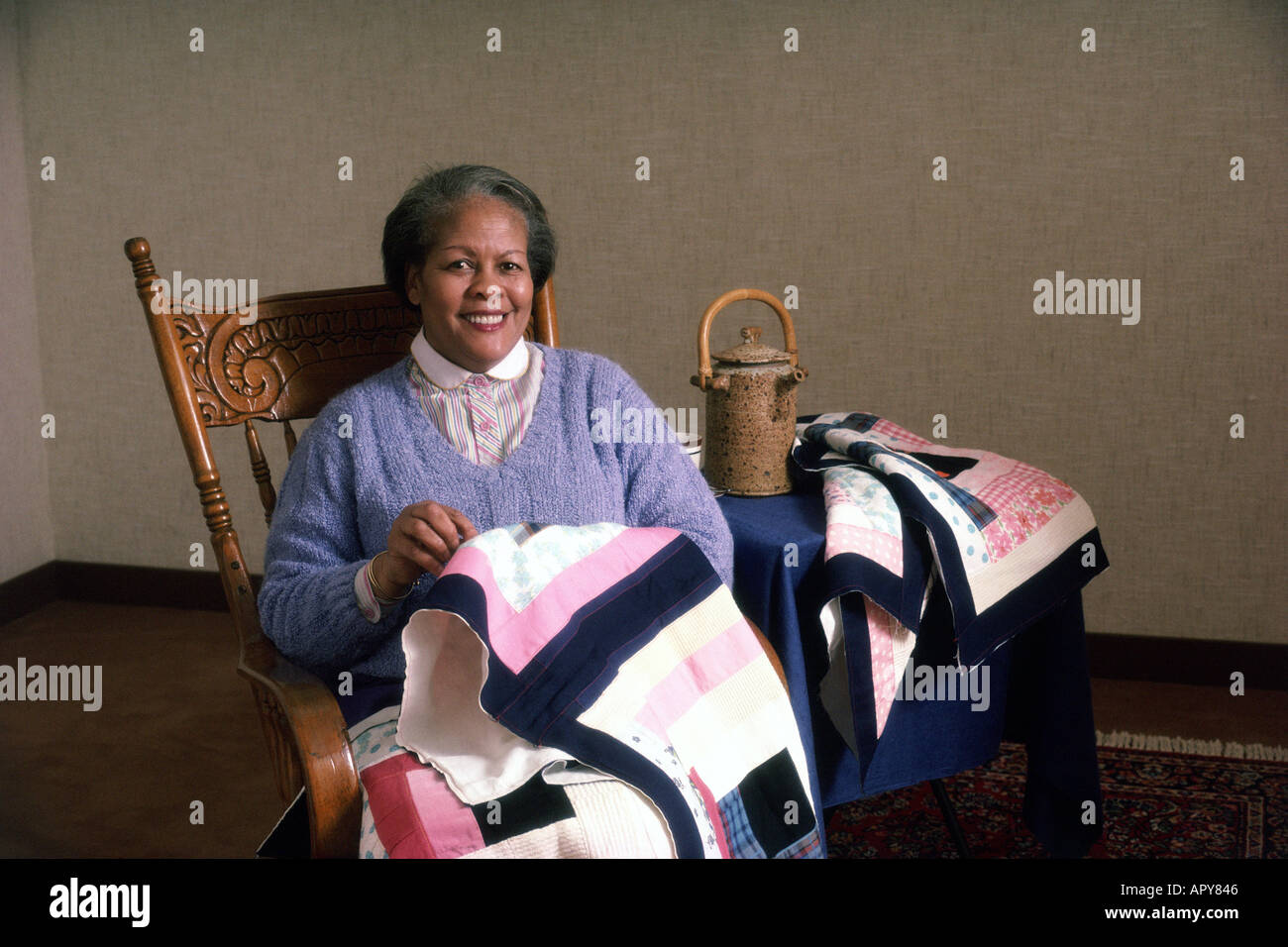 Older African American woman quilting Stock Photo - Alamy