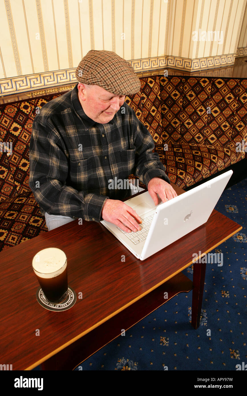 Old people men using new technology in local working mans club pub using a  mac Stock Photo - Alamy