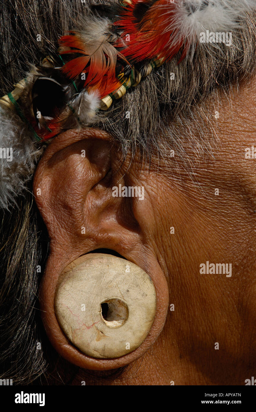 Huaorani Indian man with balsa ear plugs. In Quito, the capital of