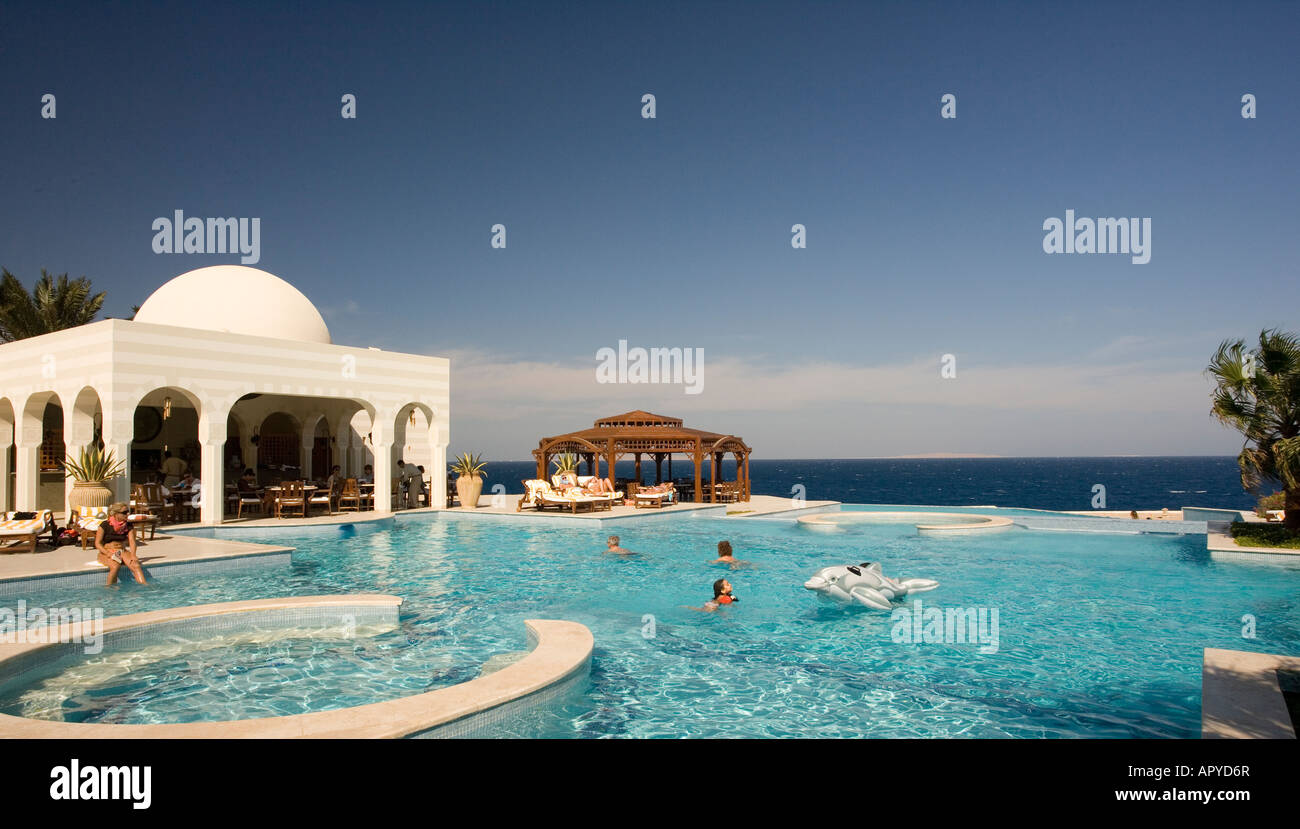Egypt, Sahl Hasheesh, Swimming pool at the Oberoi hotel with red sea in ...