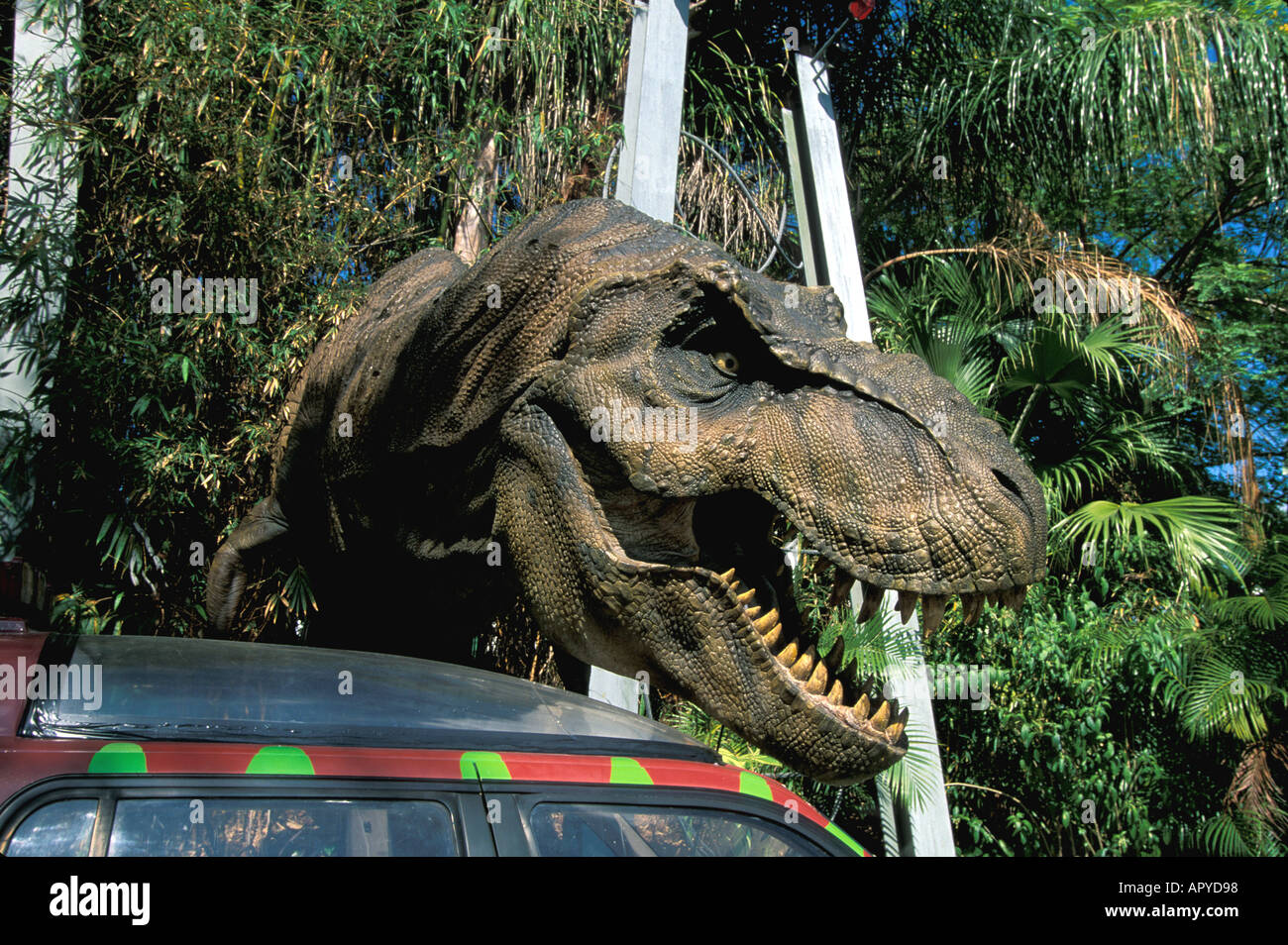 ORLANDO FL Universal Studios Jurassic Park Dinosaur beside car Stock Photo