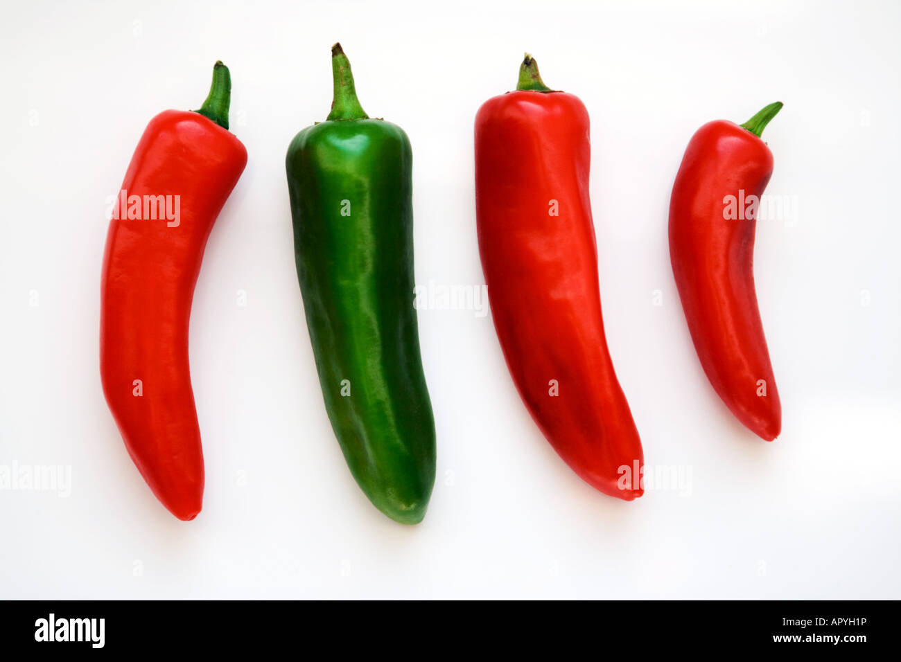 Four chilli peppers Stock Photo Alamy