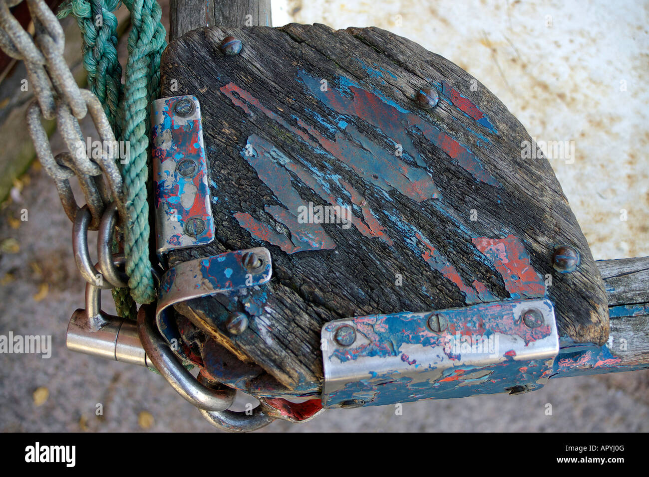 detail of a wooden small craft tied with rope and chain Stock Photo
