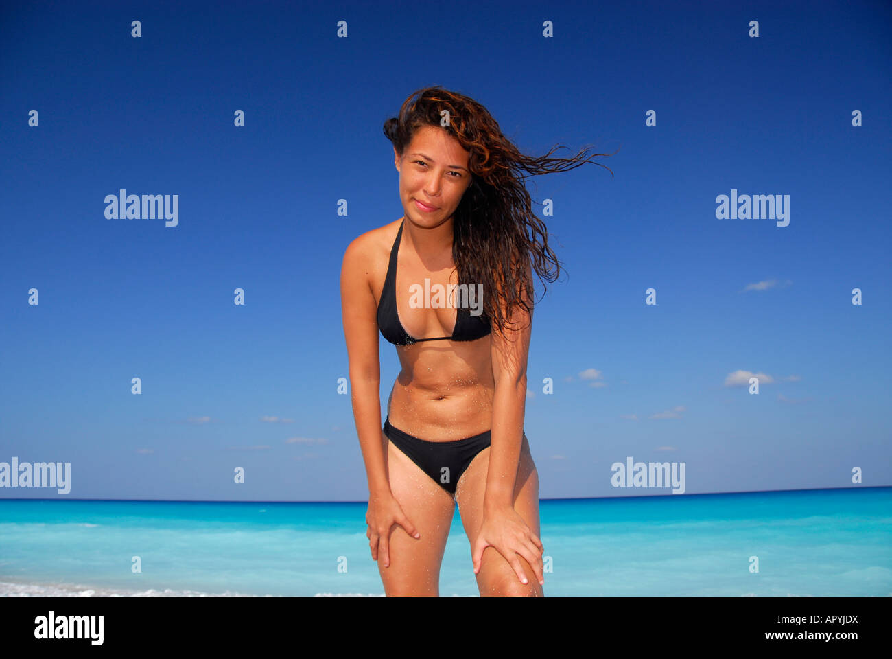 Costa Rican latin girl in bikini posing on the beach Stock Photo - Alamy