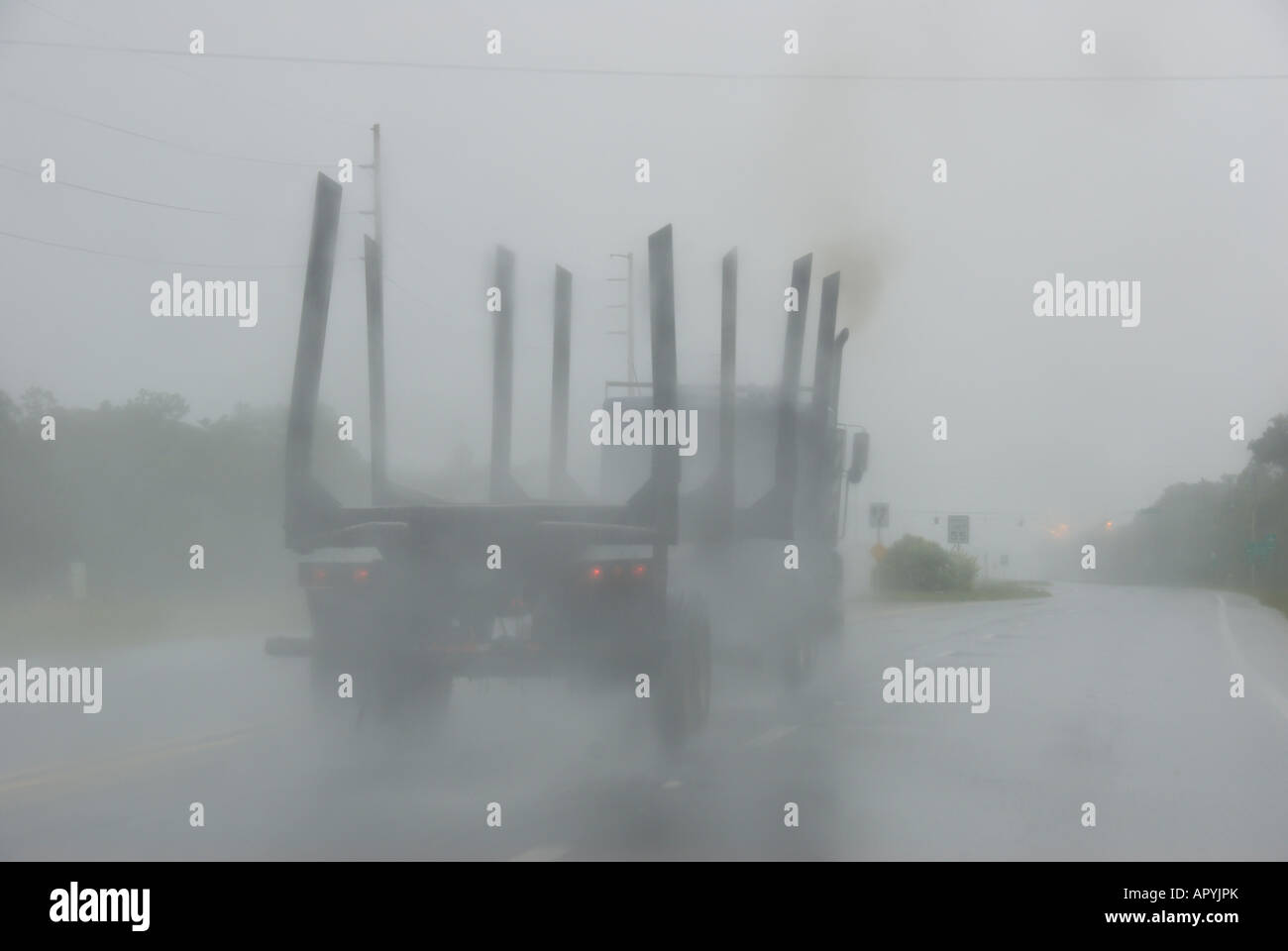 highway driving hazards danger bad weather rain truck sprays water