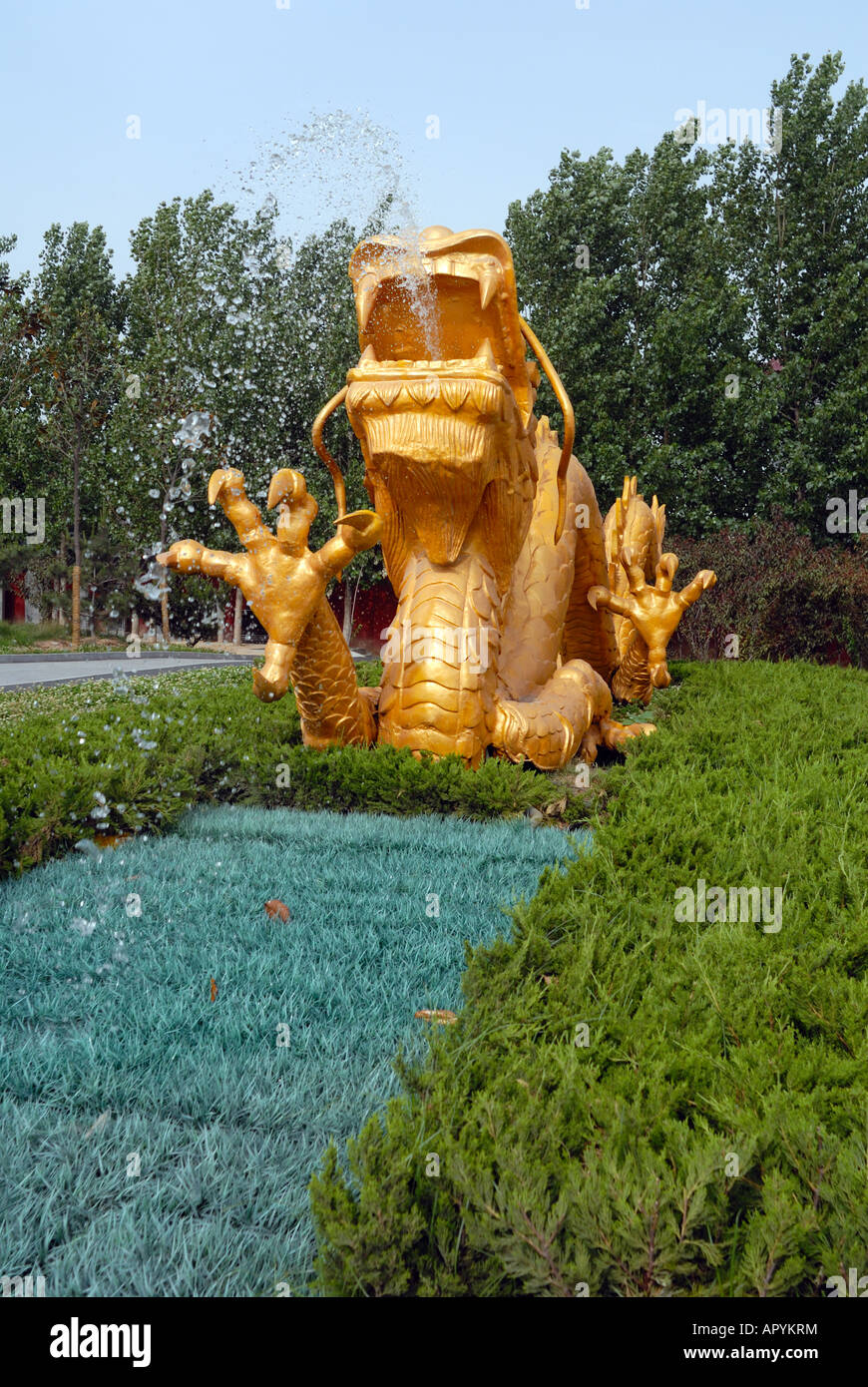 Gold coloured dragon water fountain at The Yellow Emperor s birth place Palace Huangdi Xinzheng City Henan Province China Stock Photo