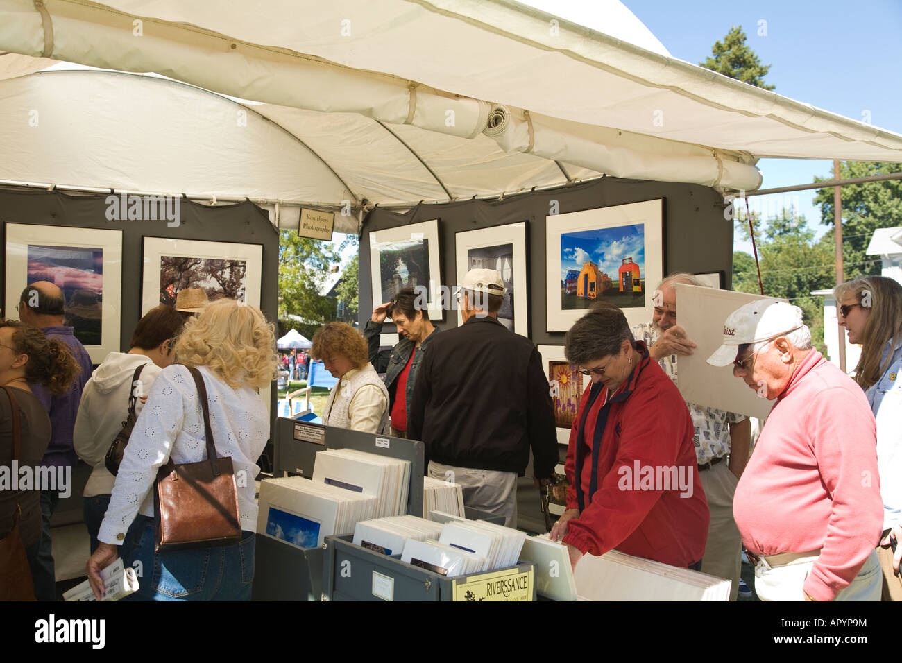 IOWA East Davenport People looking at art displayed for sale in booth