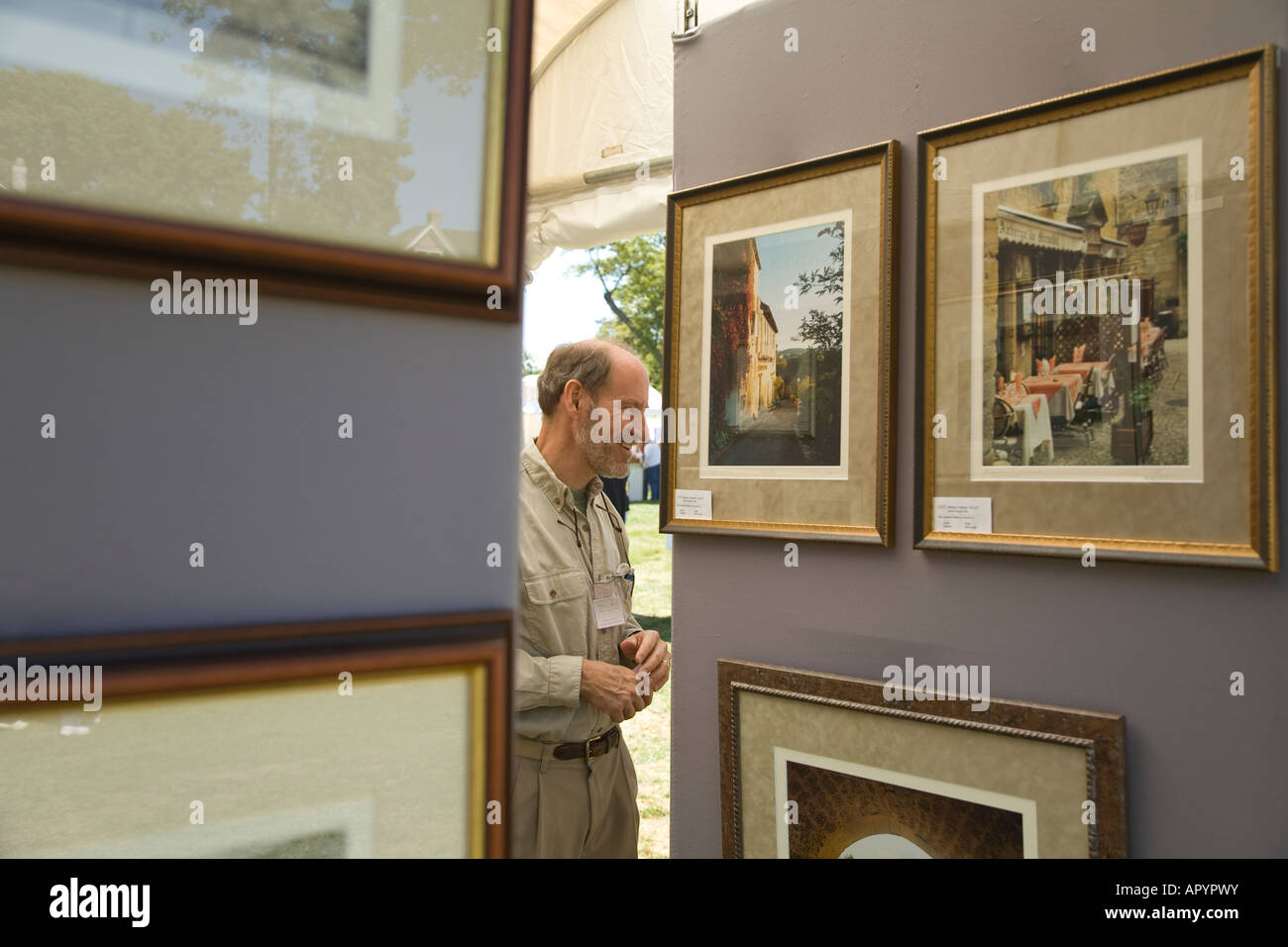 IOWA East Davenport Paintings hanging in booth at Riverssance Festival