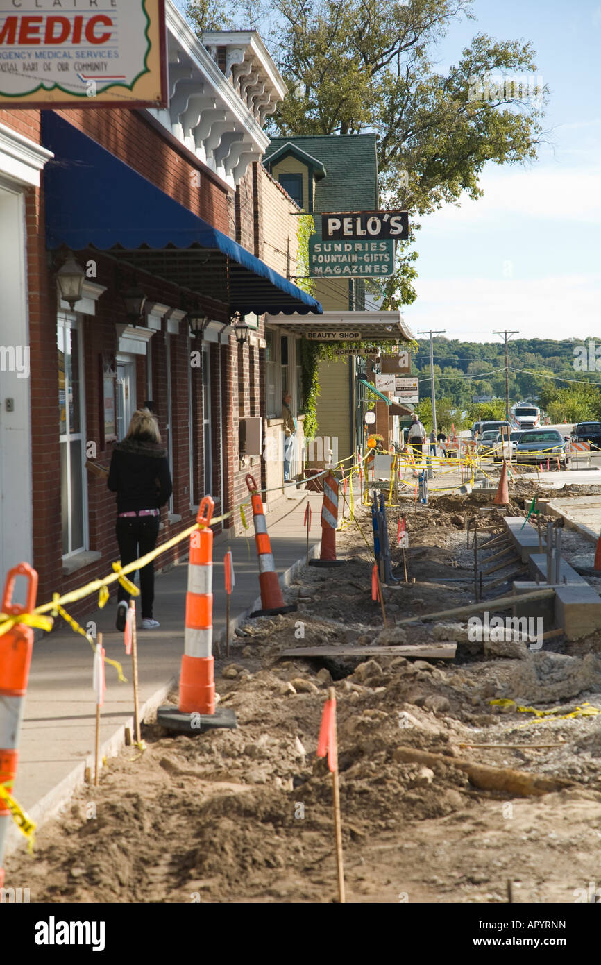 IOWA LeClaire Sidewalk under construction in downtown shopping area of small town barricades and caution yellow tape Stock Photo
