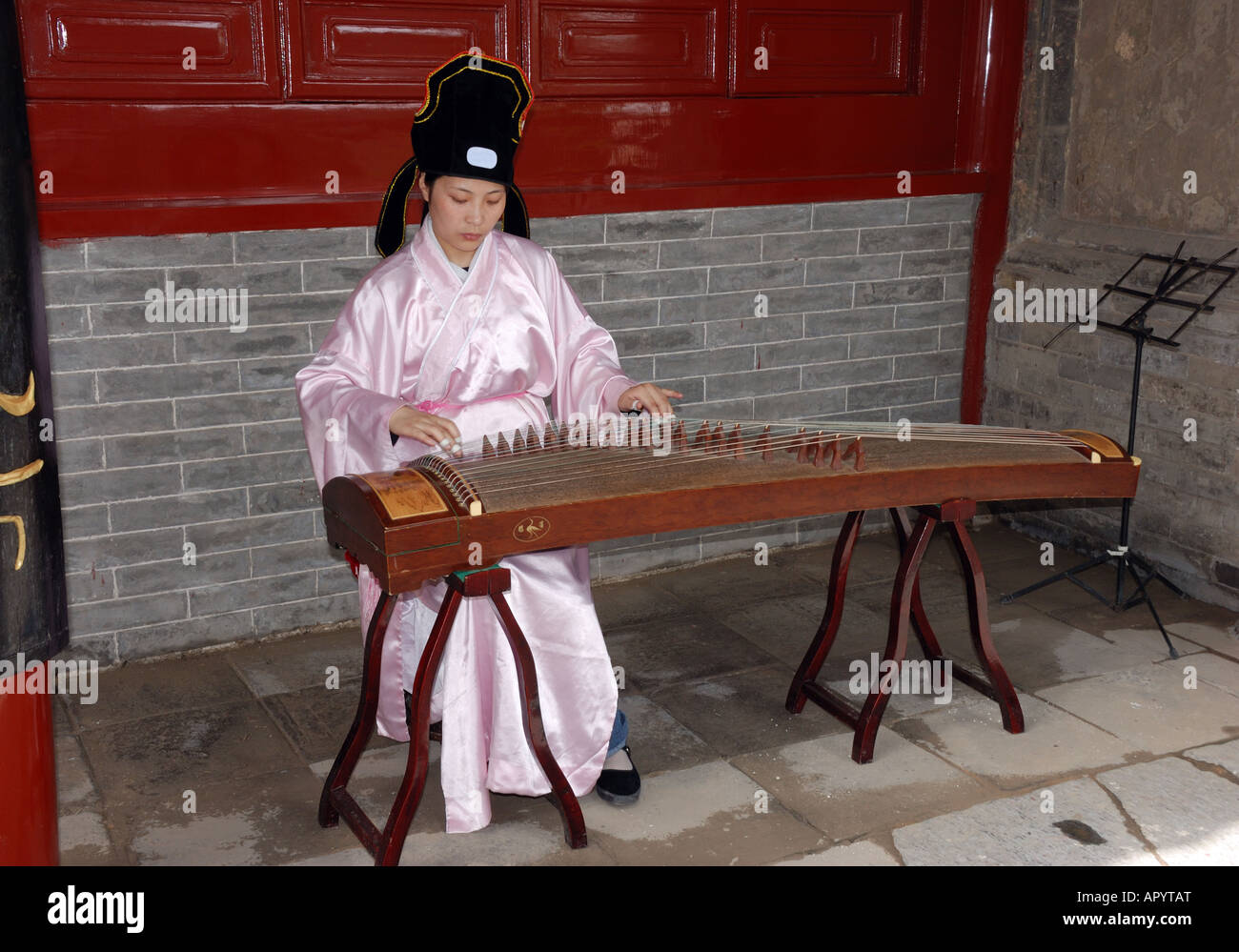 Girl musician playing a guzheng Dengfeng Henan Province China Asia Songyang Academy Stock Photo