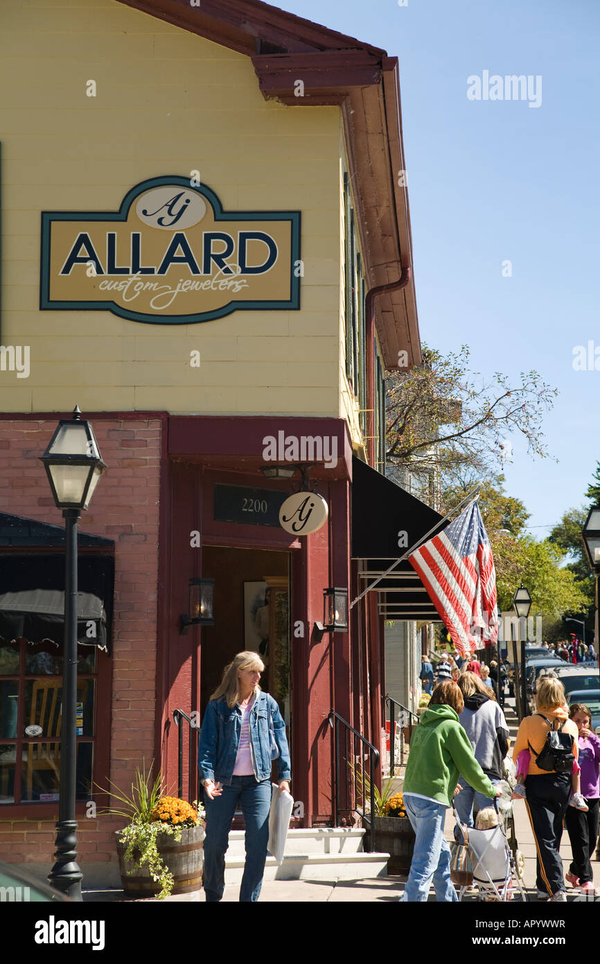 IOWA East Davenport People walking along sidewalk retail stores and
