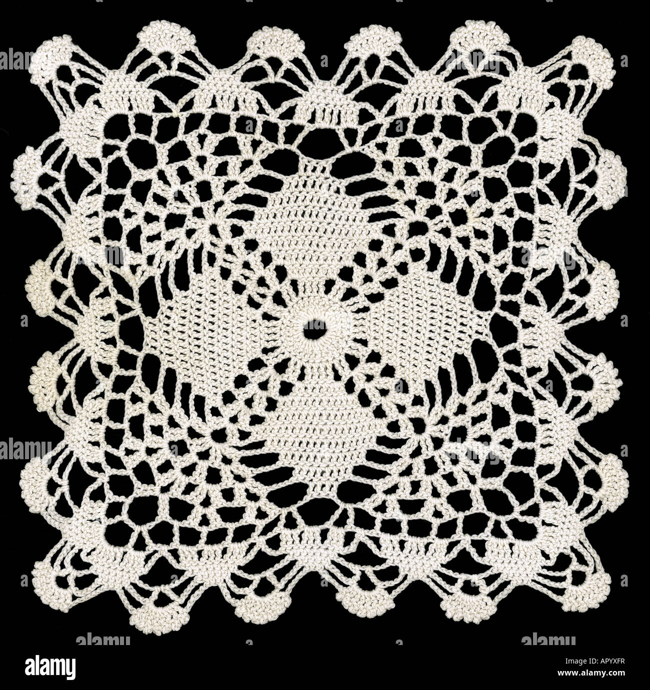 Knotted retro lace pattern on black cutout background Stock Photo