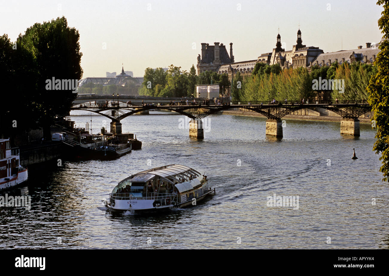 Paris Seine river tourist boat at the dusk twilight Stock Photo - Alamy