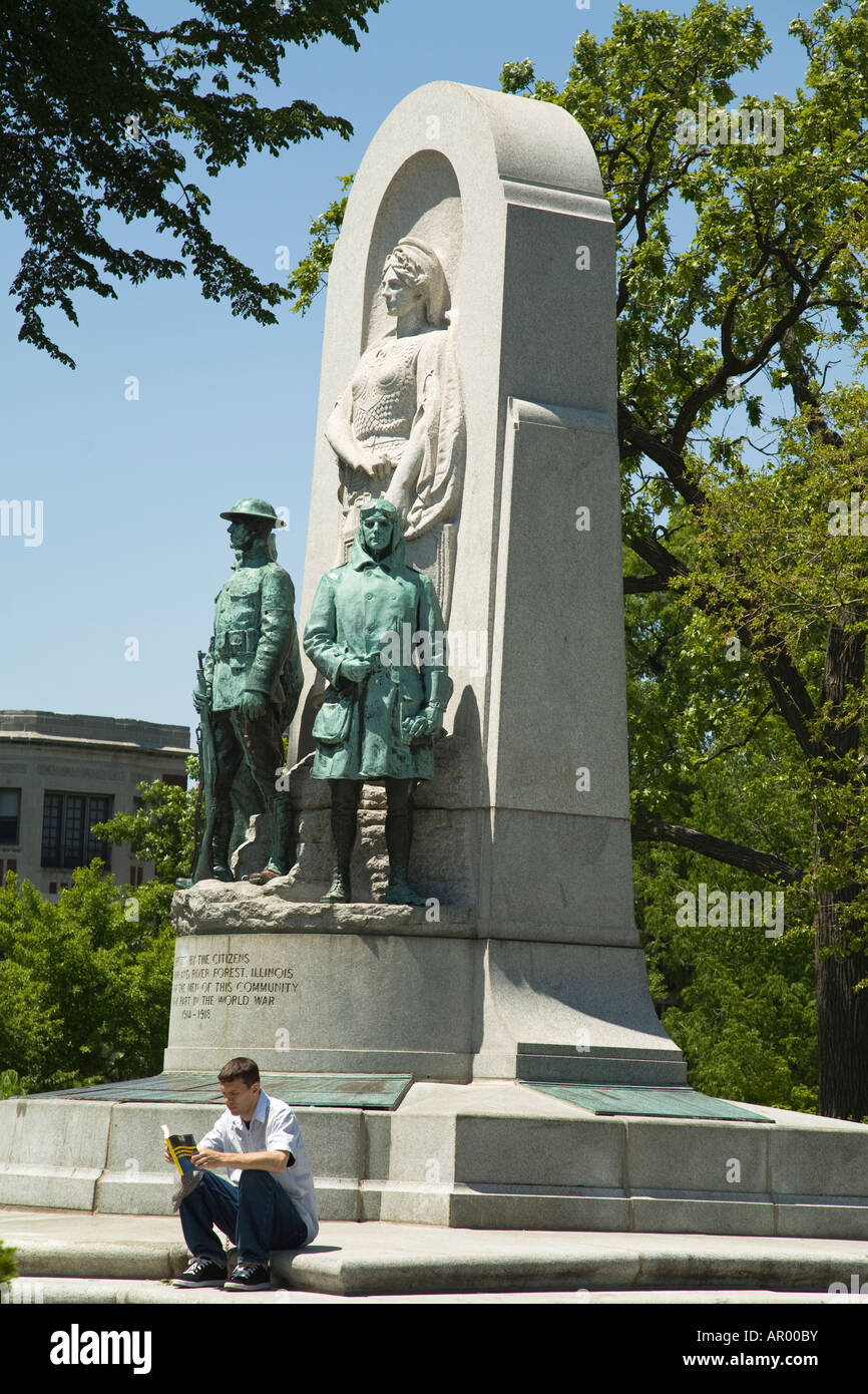 ILLINOIS Oak Park Man sitting and reading book base of War Memorial Monument in Scoville Park statues Stock Photo