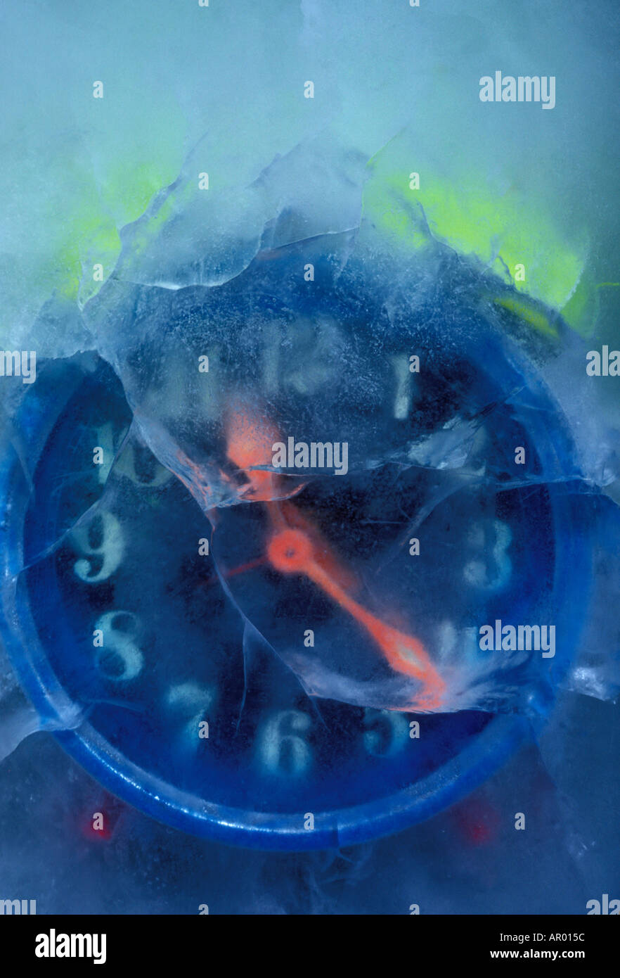 Alarm clock frozen in ice frozen time Stock Photo Alamy