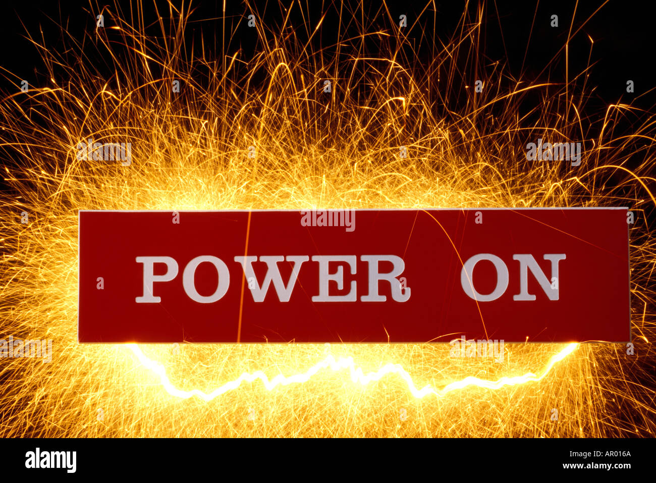 Power sign with sparks flying from behind it Stock Photo
