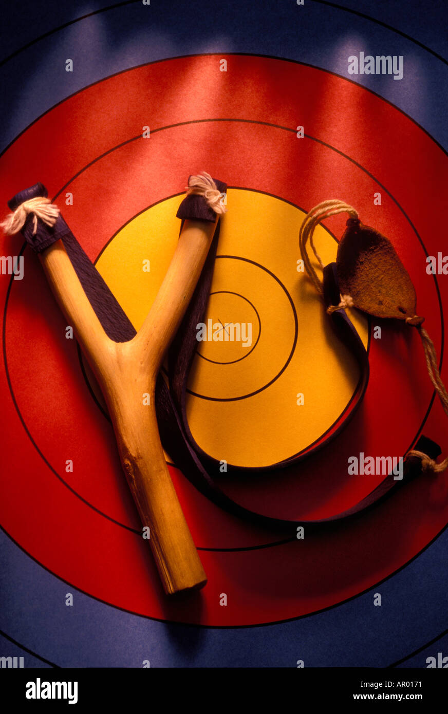 A sling shot made from wood on target Stock Photo