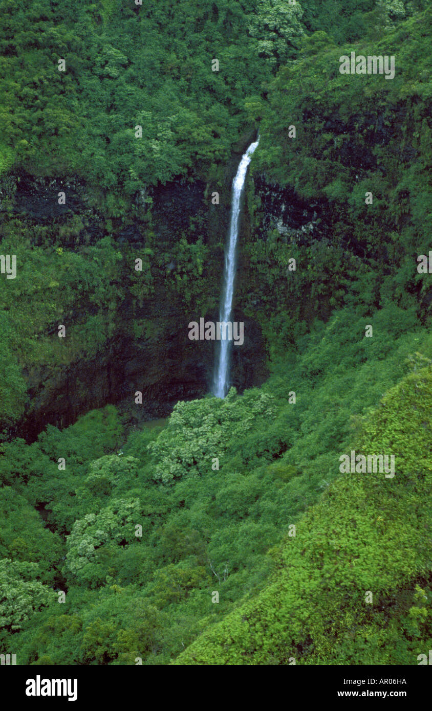 Waterfall and lush cliffs of Na Pali Coast Kauai Hawaii USA Stock Photo