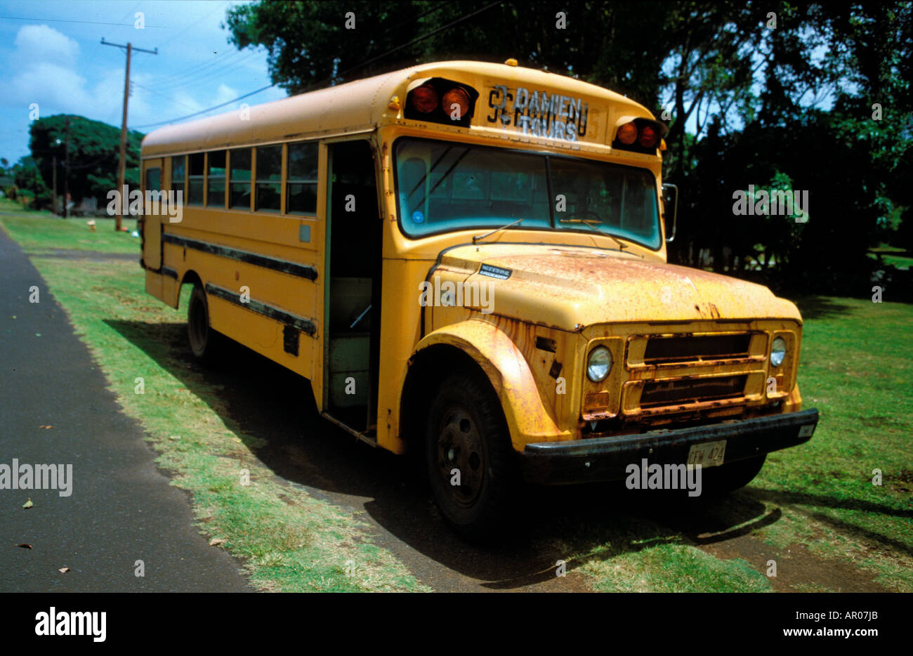 An old schoolbus used to tour Kalaupapa on the island of Molokai Hawai Stock Photo