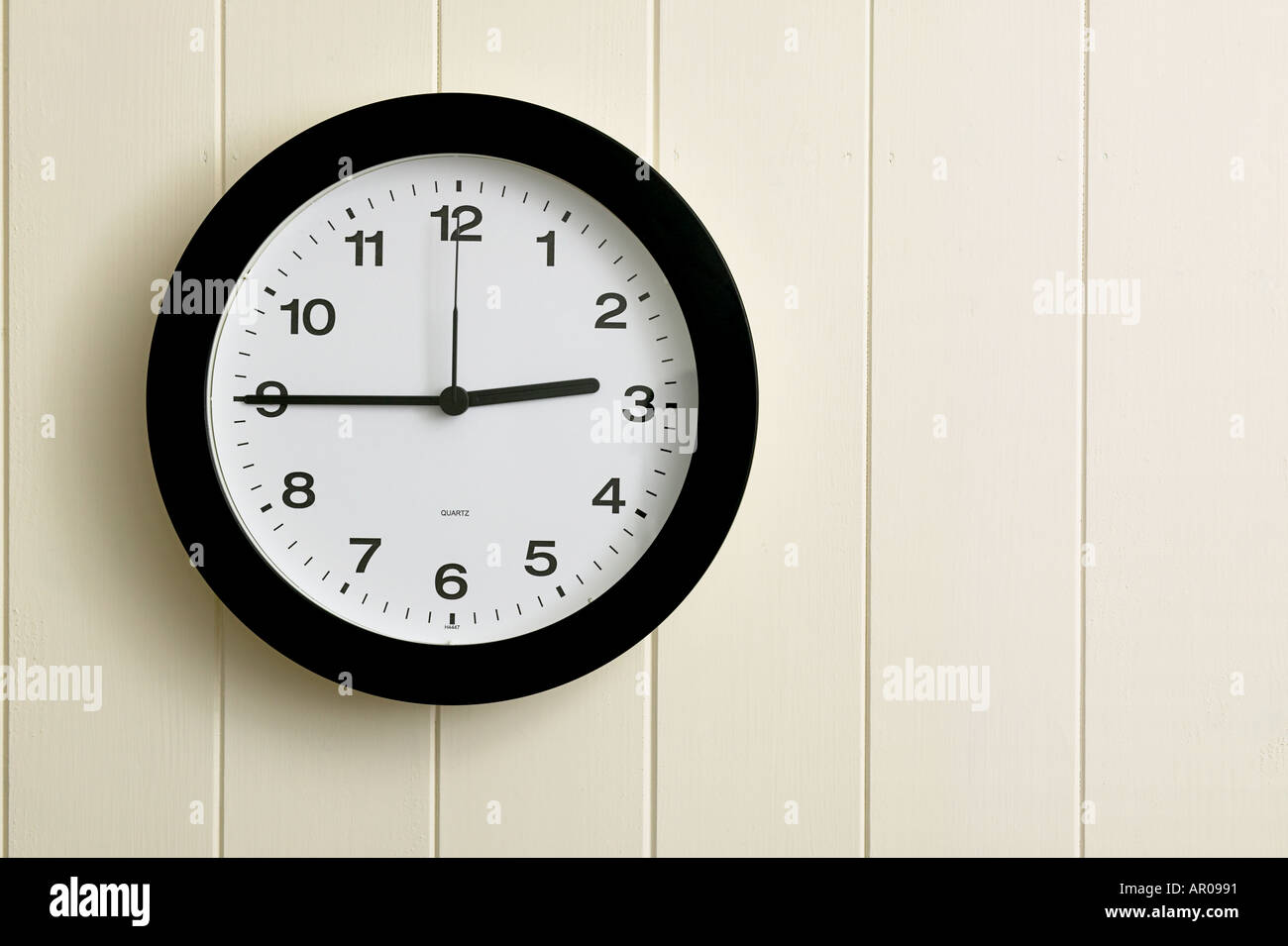wall clock showing time at quarter to three 0245 1445