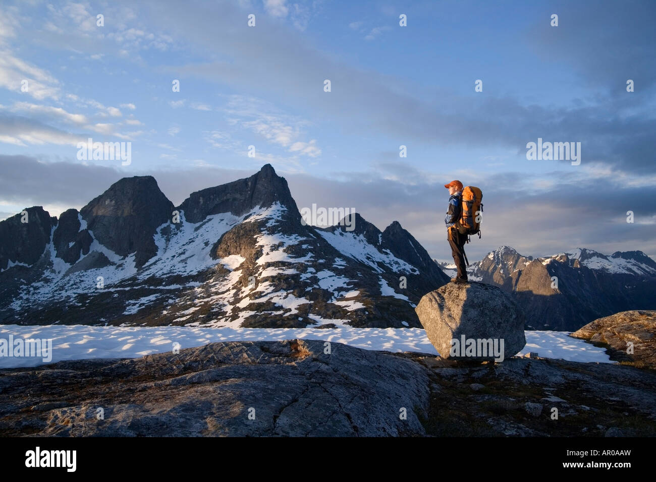 Female Hiker standing on rock overlooking Lynn Canal & Berner's Bay