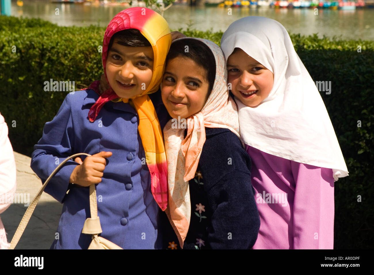 Young iranian girls walking by Khajou river Esfahan Iran Stock Photo