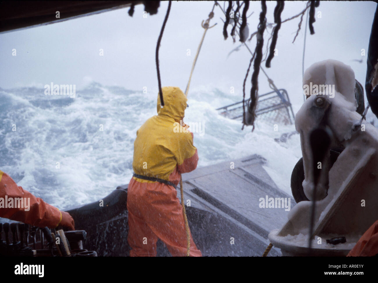 Fisherman Working on Deck in 50 Knot Winds Bering Sea AK /nOpilio Crab