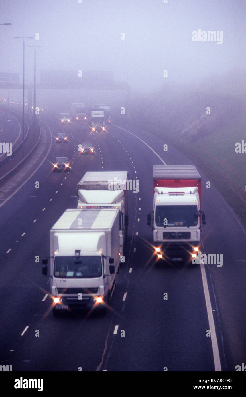 traffic travelling on the A1 M1 motorway in thick fog Leeds Yorkshire UK Stock Photo