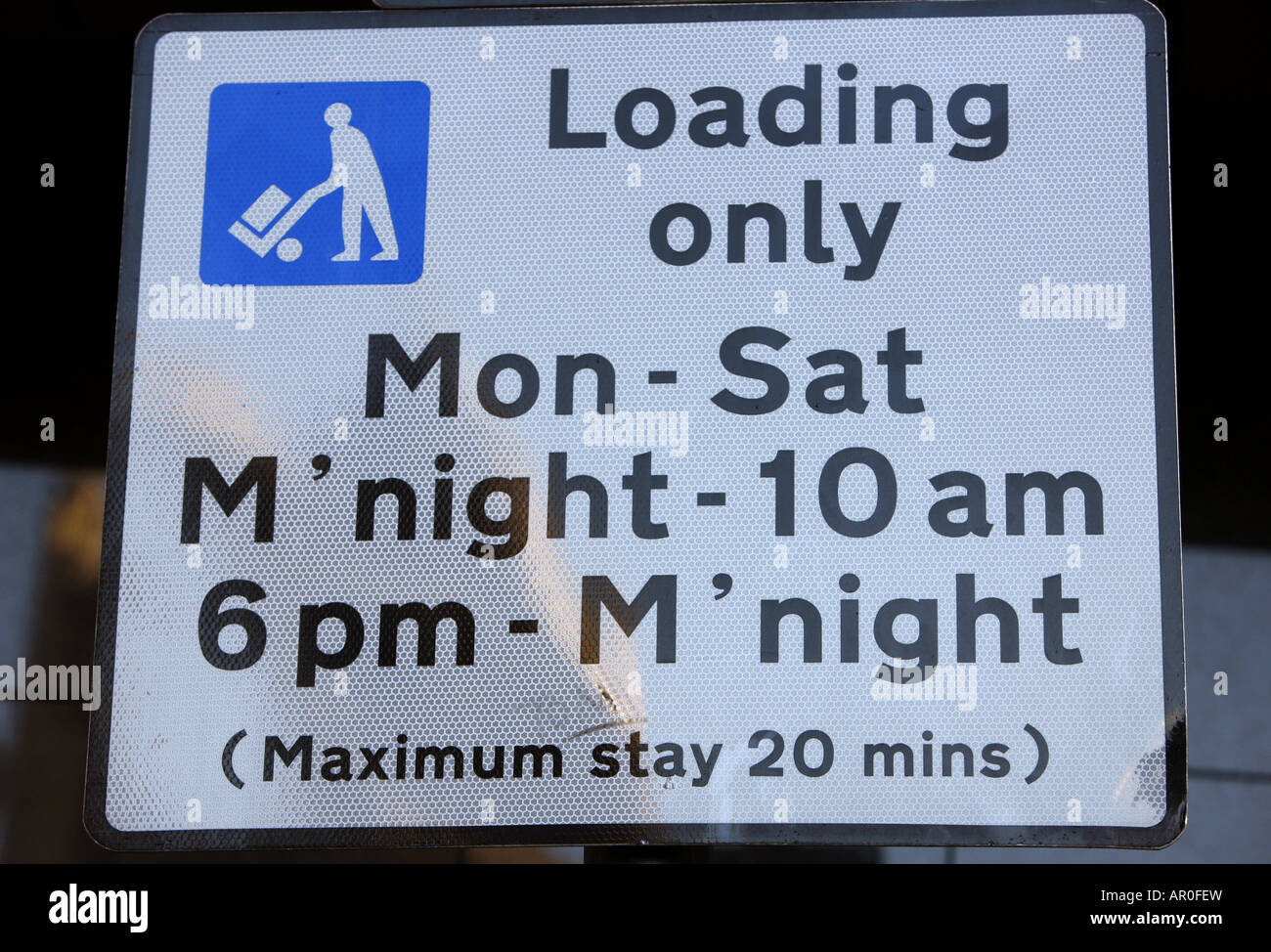 warning sign for loading only for vehicles at roadside bay in the city of Leeds Yorkshire UK Stock Photo