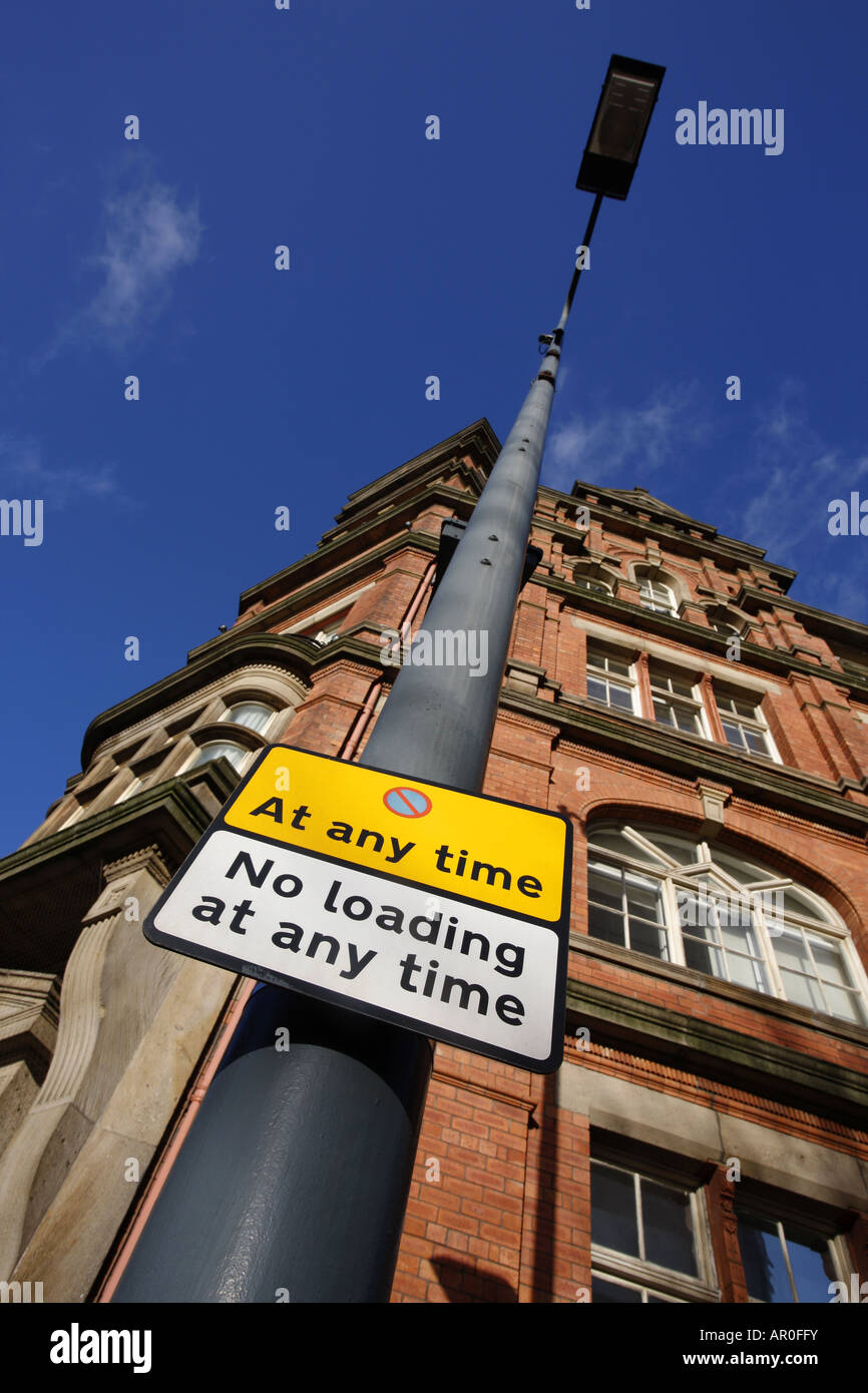 no stopping and no loading restriction warning sign for vehicles at roadside in the city of Leeds Yorkshire UK Stock Photo