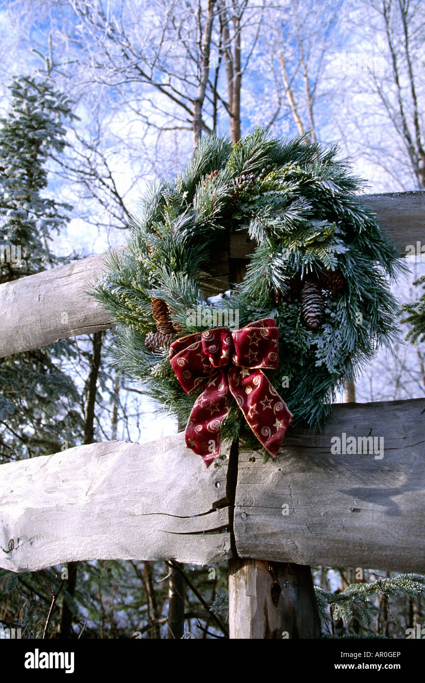 Frosted Pine Wreath on Wooden Fence Winter Alaska Stock Photo