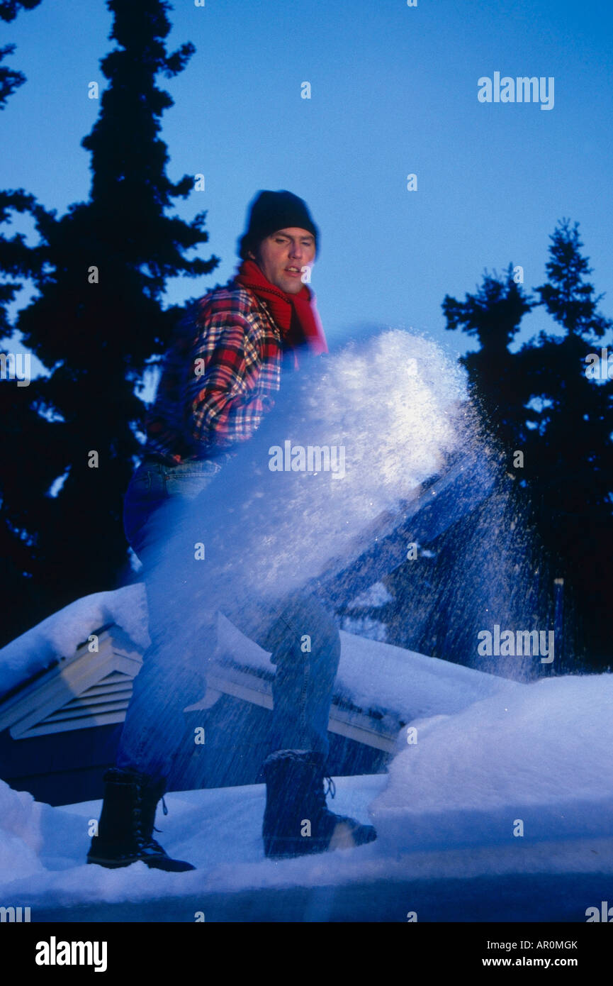 Man shoveling snow off roof Anchorage SC AK winter PR portrait Stock Photo Alamy