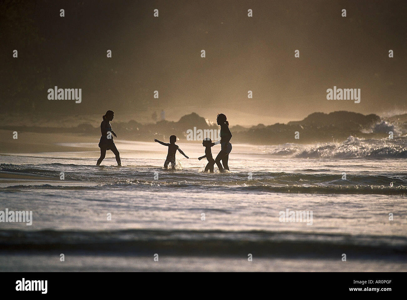 Sandstrand bei Black Rock, Frauen mit Kindern, Nordkueste von Tobago, West Indies, Karibik Stock Photo