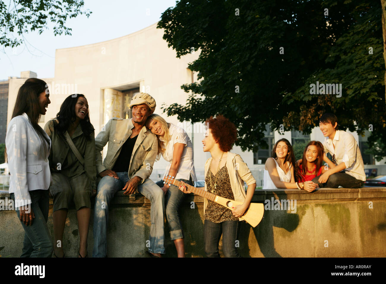 Mixed race group happy outdoors Stock Photo - Alamy