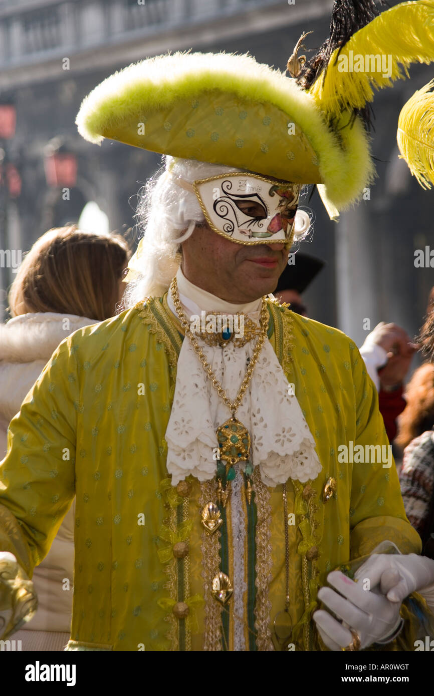 Reveller in mask and costume at the Venice carnival, in St Mark's