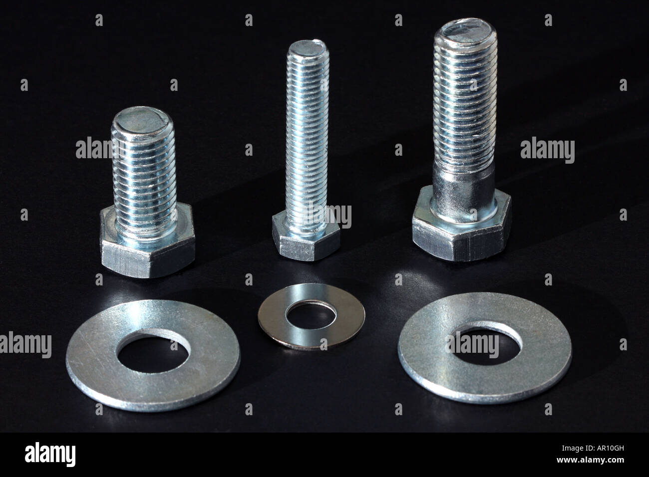 A line up of some large bolts with matching washers Stock Photo Alamy