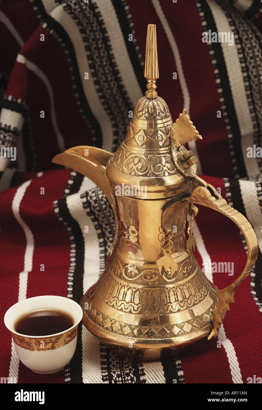 Arabic Coffee pot and cup with coffee Stock Photo - Alamy