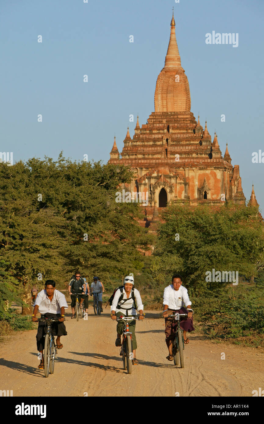 Bicycle tour, local guides Pagoda, Fahrradtour, zwischen Pagoden, Touristenfuehrer, cycle tour, biking in Burma Stock Photo