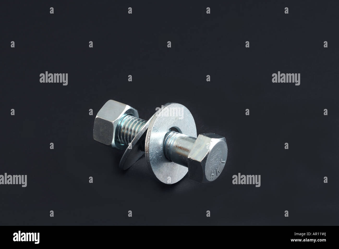 A bolt with washers and nut attached Stock Photo Alamy