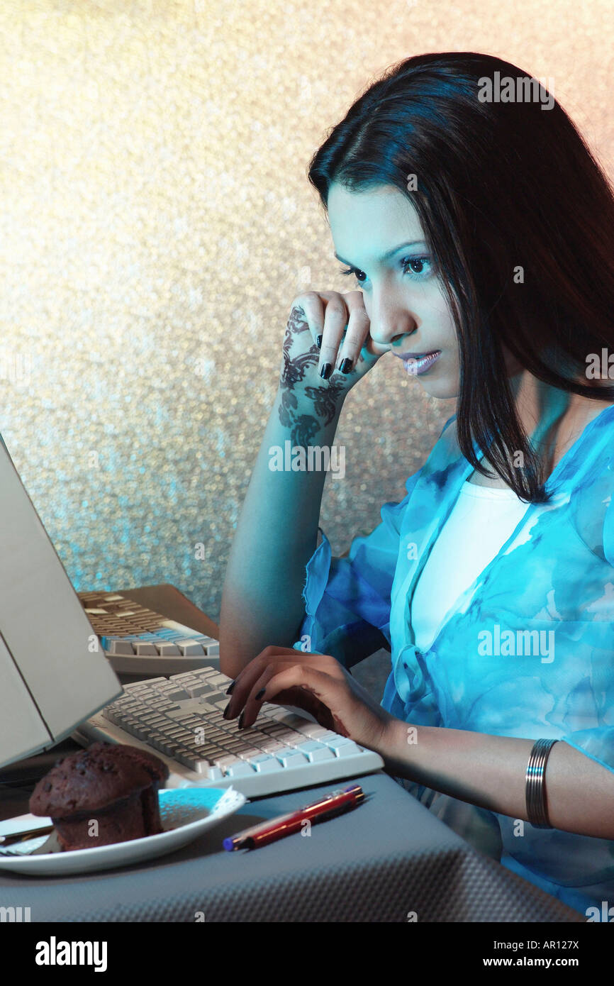 Lady on a computer Stock Photo - Alamy