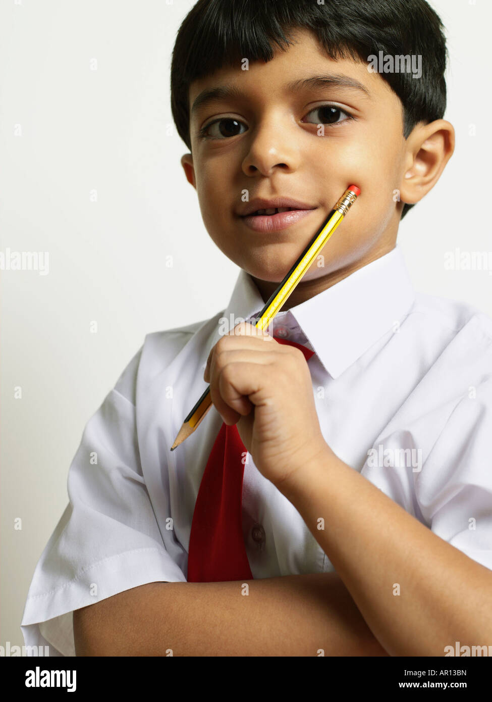 School Boy holding pencil Stock Photo - Alamy